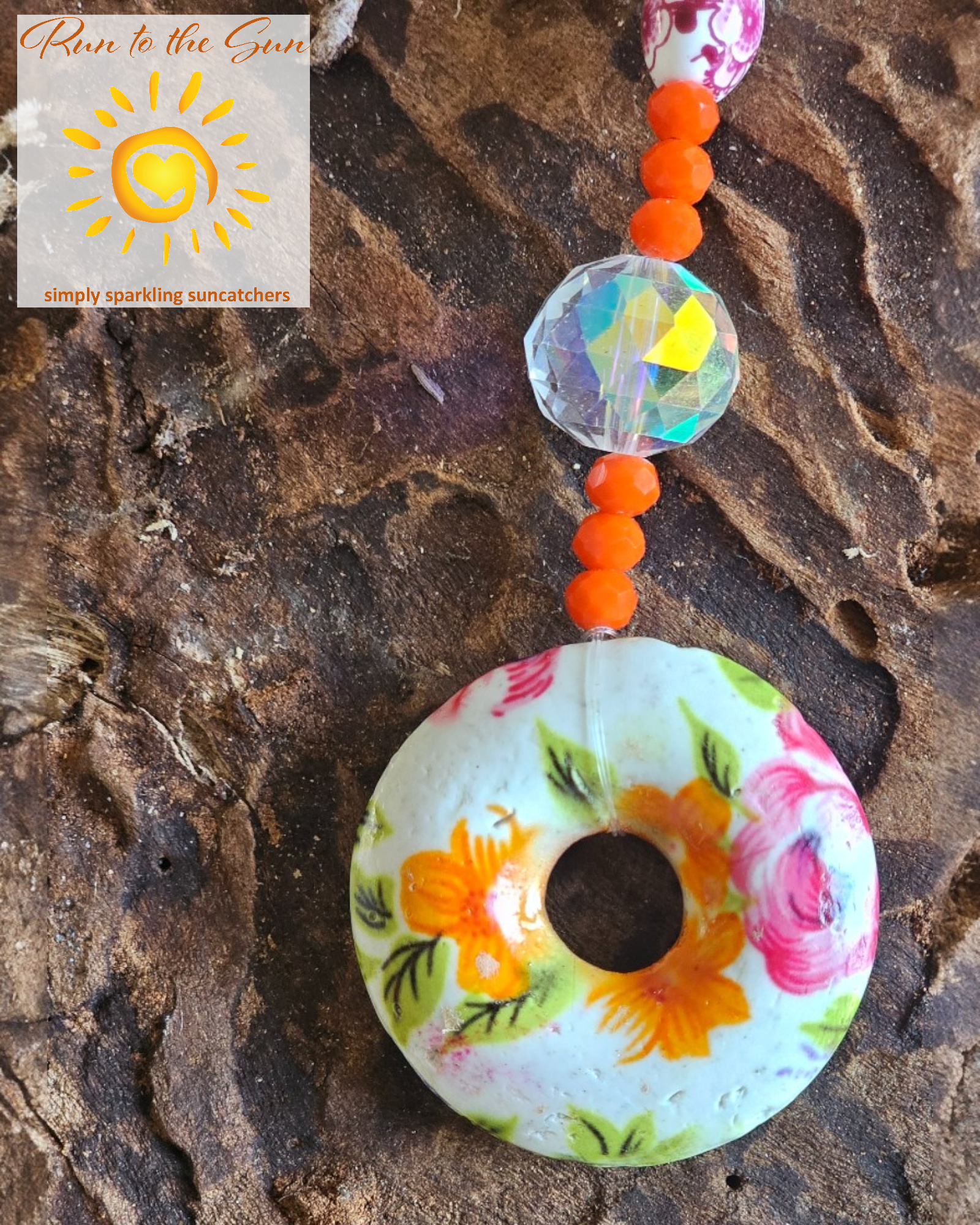 Ceramic donut Pendant Suncatcher with pink, blue and orange beads detail